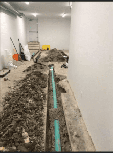 A long green pipeline inside a house